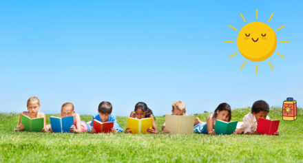 Seven children in the grass reading. Sun is the sky and sunblock is on the ground